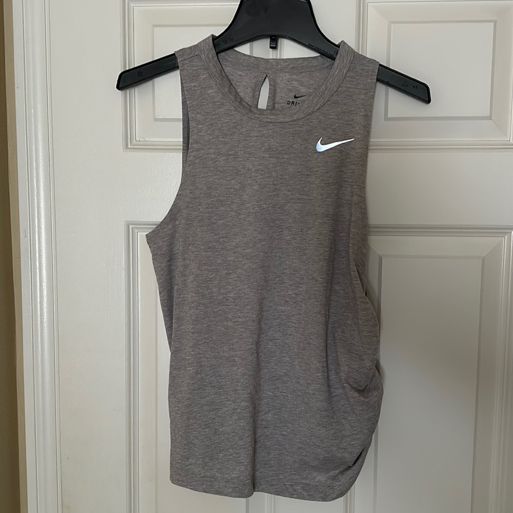 Nike heather grey dri-fit tank with side gathering and open slit back. Size Sm